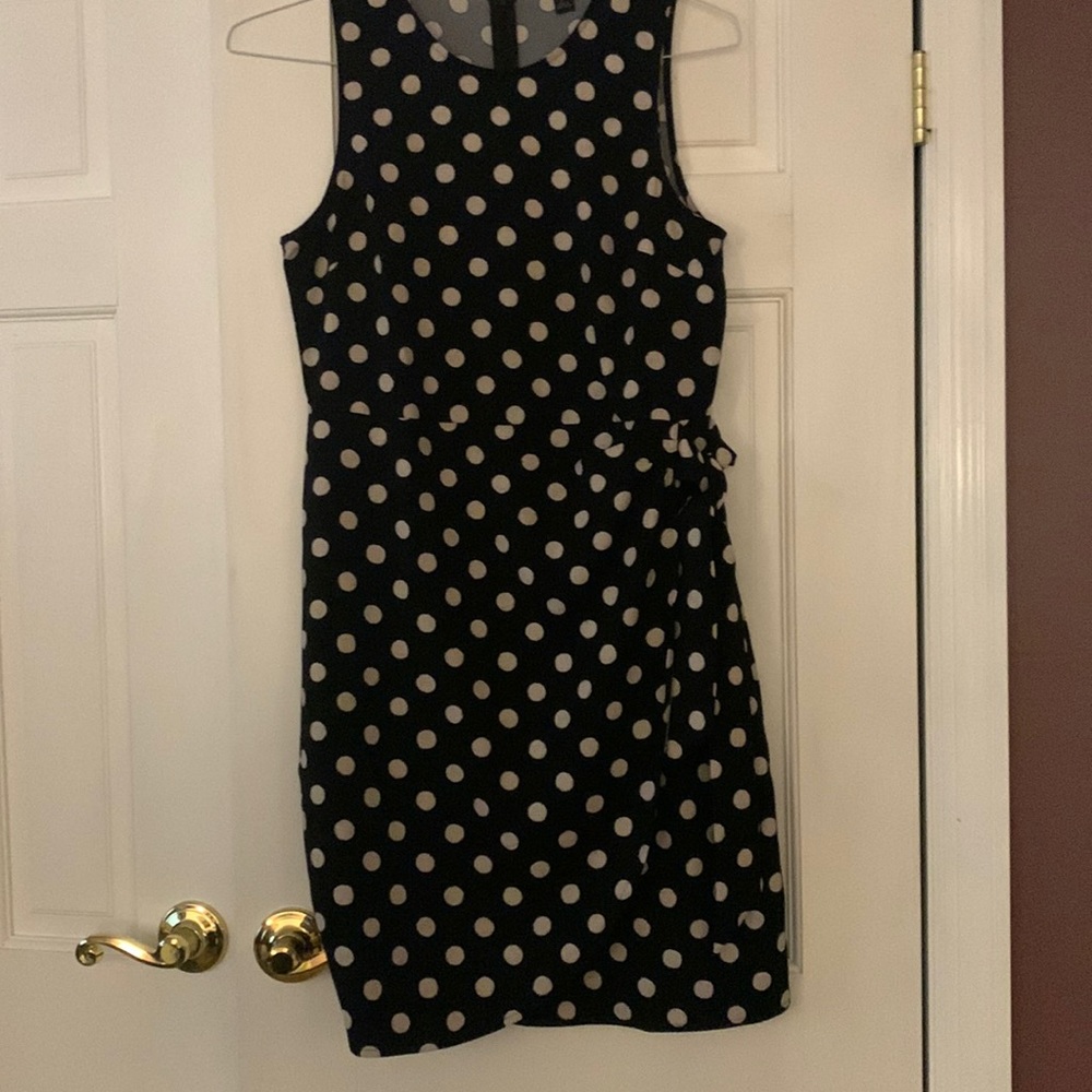 Black dress with beige polka dots. Bottom wrap with a tie on left side